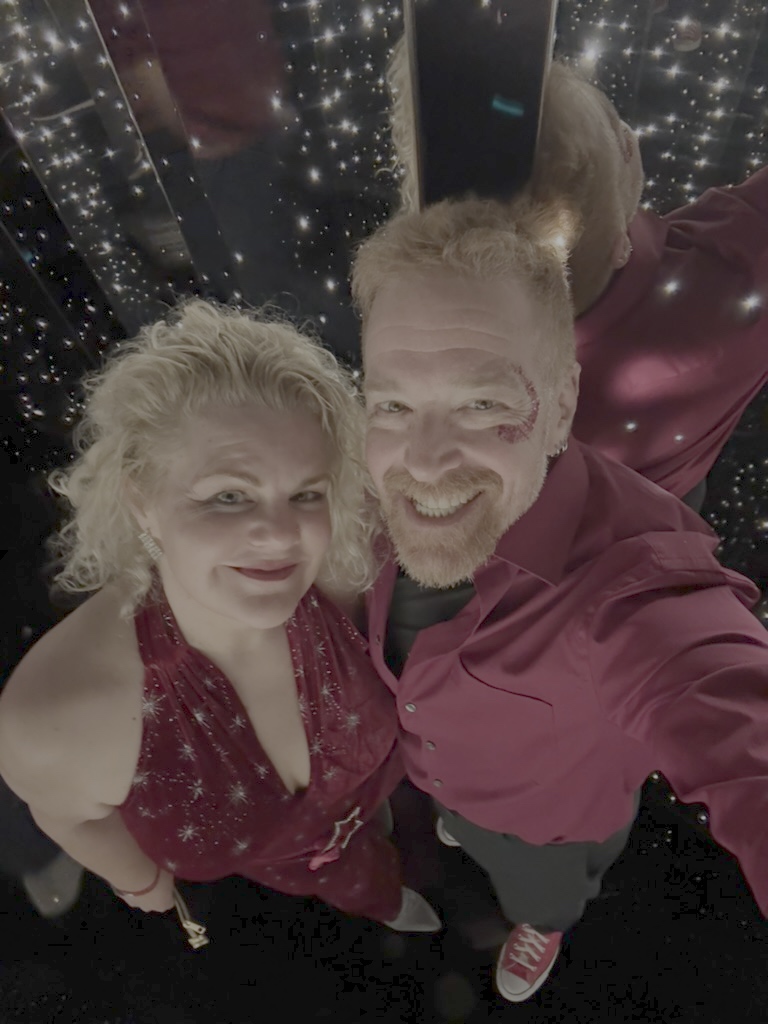 Andrew and Jen dressed in scarlet for Scarlet Night aboard Brilliant Lady